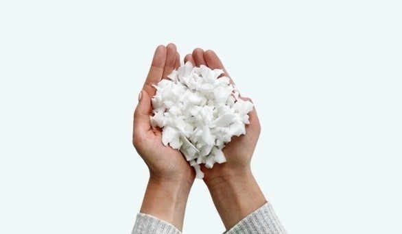 a woman holding foam