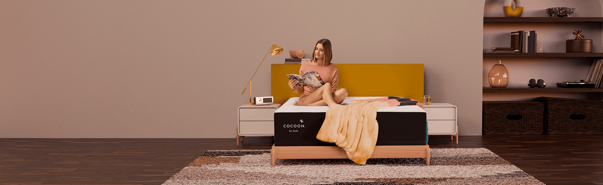 Woman sitting on Cocoon mattress in styled room reading - extended
